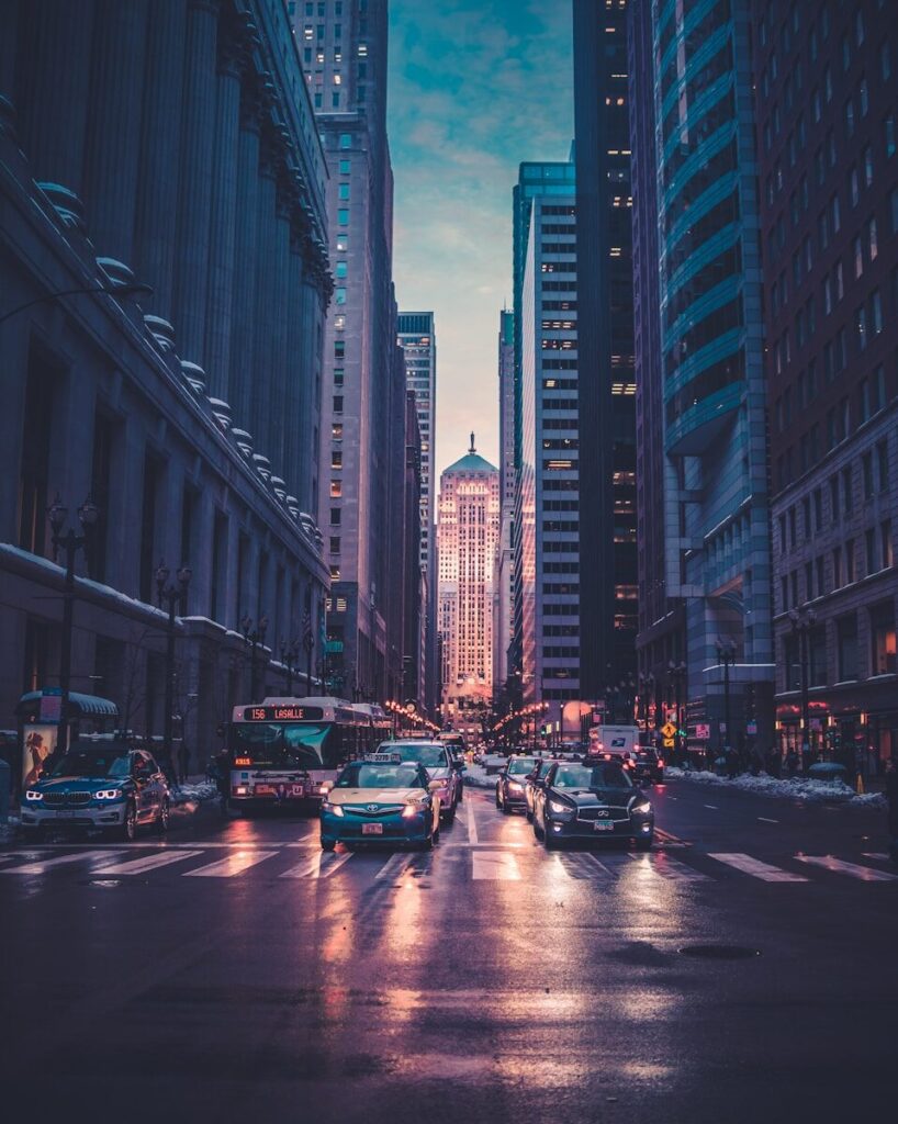 vehicles near buildings at night time