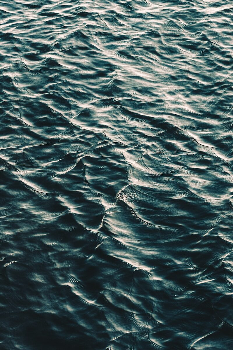 rippling dark teal water surface